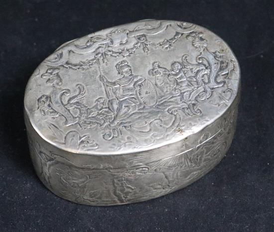 An 18th/19th century Continental white metal oval box decorated with classical scenes centred by Zeus,